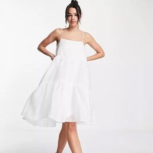 White strappy drop hem bridal dress